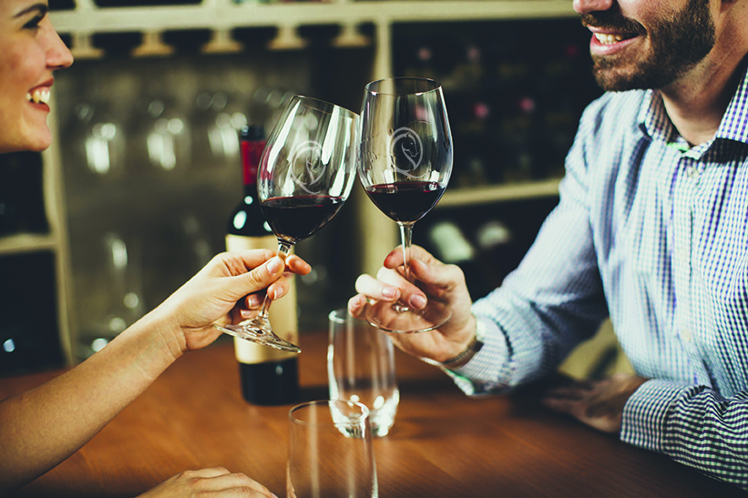 Handsome young couple on the date in wine bar